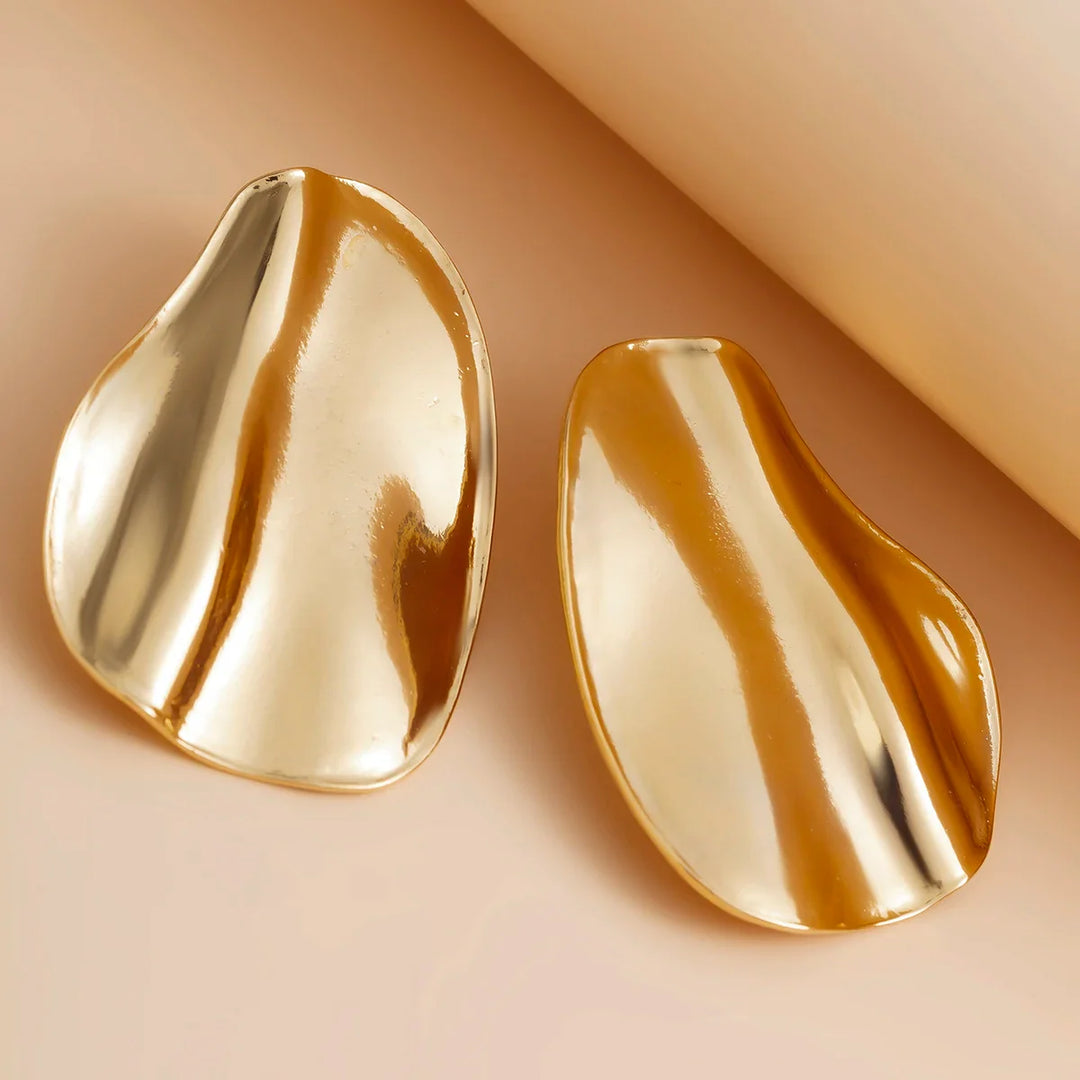 Abstract statement earrings with a sculpted metal design